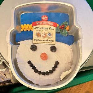 Brand new Wilton snowman cake pan with paper insert